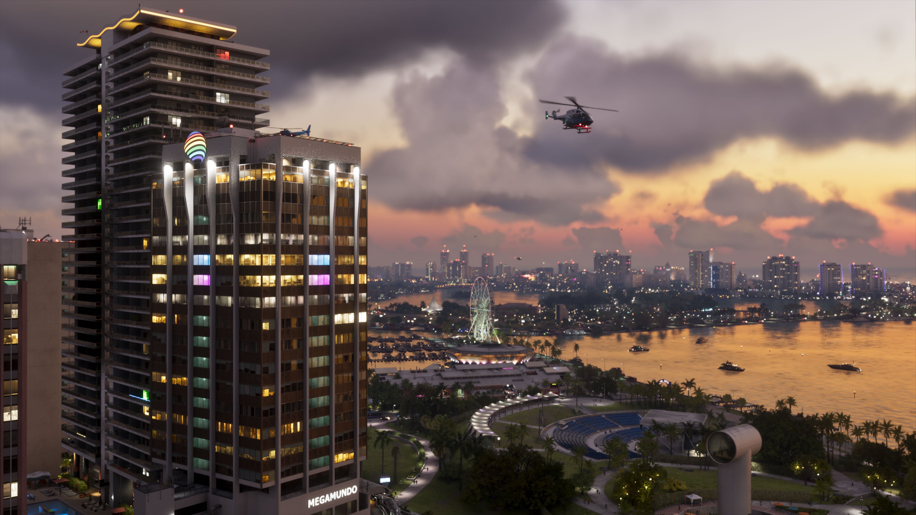 Vue officielle de Vice City au crépuscule avec un hélicoptère au-dessus de la baie.